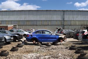 Blue Scrap Car in a U-Pull-It yard