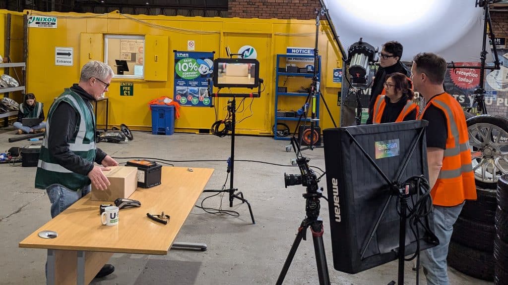 Behind the scenes Advert. Camera Crew filming UPI Staff member.