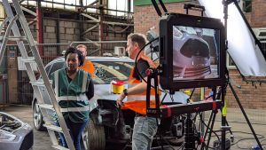 camera crew behind the scenes while filming at UPI yard