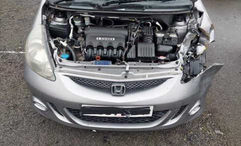 a car engine in a silver car